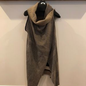 Reversible cowl neck sleeveless sweater vest.